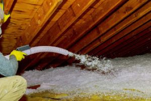 Technician spraying blown Fiberglass Insulation between Attic Trusses foam insulation repair tool in the white protect suit applies a construction foam from the gun to the roof. SSUCv3H4sIAAAAAAAEAJ1Uy46cMBC8R8o/jHyekbANDOyvrHLwixlrDUa22exqxL+veRiayUaRcqOrqnG7utuPnz9OJ8SZ1wK9nB5TFGNtzOCDY0HbLsLZecWV1ME6zcwETtg4M8gHFgavPPgFJtQ1McYplxnWfkKA65sPVrz1dxtsJGgiBOsOxJYhrLGD4/YDqqXqrddhFnuolk6x1gfdKog2UWY0g1Br/Tfpve1kAQF/H0JQbi4NFvCupbLcRPSQL6KDtm1CTyYUmCVYULfo4sGu1IHXJT4lYjUkRAqhM8D8wGcsQeP5vzOXj19bo26qE1OnHiOo2imj2NLi10WK3n5HO9r5FqtotgLEbJDaglu+W8HMlEDBn3unhe5uIM2Gu3IgXqwEQGfDXMl6MSSjpVOIKa5IVpe0yOr6SnNyRWlAY3u0hLUuM3vXkXKfoMahN5ZJJXfom1nFBb2WBJdVvTn7PB9JUle75DiSi+Ca4V3wx+gnDdk122CuHM7AAc/LkDQgH2xAYvOdfZrmpChBjYfBXgUEHHDcpyQANmxPwcrlwMXt3Vi4KqMLNW5rOPBWR6OPDYJPw3YkuNZfGlgV/2xgVeK1AjCzejodcZkrInN8aVTBL3ks9sJ5Ri+MNXktKaY5JXHNxi9DTm7PZQUAAA==